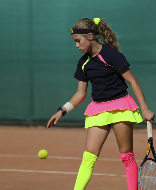 isabella layered girls tennis skirt in navy and neon by zoe alexander